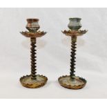 A pair of copper and brass trench art candlesticks with twisted wire stems,