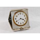 A silver cased folding bedside clock, with eight day movement, Birmingham 1925 by Adie Bros Ltd,