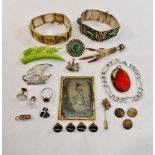 A collection of mainly costume jewellery including a Scottish silver mounted bird claw cloak brooch,