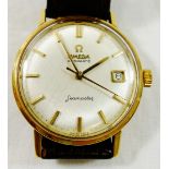 A 1960's yellow metal cased gentleman's Omega Automatic Seamaster wrist watch,