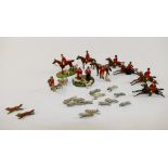 A collection of hand painted cast lead hunting figures, including two foxes, hounds, puppies,