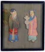 An early 20th century Chinese fabric covered panel mounted in relief with a pair of painted fabric,