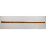 A bamboo walking cane with brass removable top, the cane containing a yard stick,