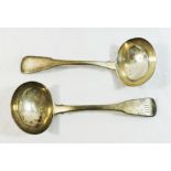 A pair of George III silver fiddle pattern sauce ladles, London 1815, combined weight 3.