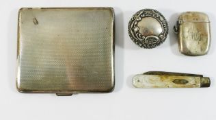 A late Victorian circular silver decoratively embossed pill box, Birmingham 1895, with hinged lid,