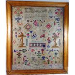 A large 19th century sampler by Anne Evans, aged 15 years, dated 1856,
