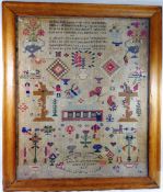 A large 19th century sampler by Anne Evans, aged 15 years, dated 1856,