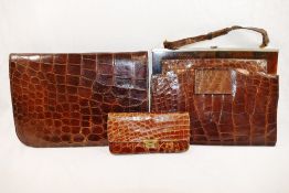 A 1930s crocodile skin clutch bag, 24cm wide, a crocodile skin handbag,