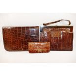 A 1930s crocodile skin clutch bag, 24cm wide, a crocodile skin handbag,