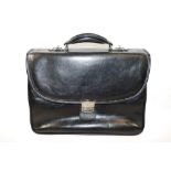 A Gianni Conti black leather case, 39cm across x 32cm high (including handle),