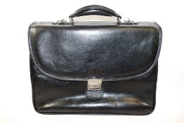 A Gianni Conti black leather case, 39cm across x 32cm high (including handle),