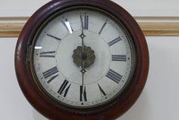 An early 20th century chain driven wall clock, the circular painted face with Roman numerals,