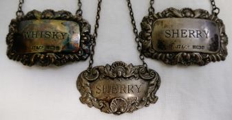 A pair of silver decanter labels, Birmingham 1981, engraved 'Whisky' and 'Sherry',