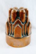 A Victorian castellated copper jelly mould, stamped with maker's mark 'R&B' to the rim, 14.