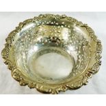 An Edwardian circular silver bowl with pierced decoration and ornate rim, Chester 1902 by George,