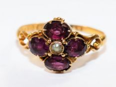 A Victorian 15 carat gold amethyst and seed pearl flower head ring, Birmingham 1862, 1.