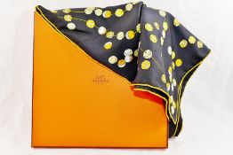 A Hermes 'Dancing Pearls' black ground silk scarf, designed by Virginie Jamin, 89cm x 89cm,