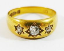 A Victorian 18 carat gold gypsy set diamond three stone ring, Chester 1894,