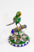 An Indian silver and polychrome enamel ornament in the form of a parrot on a perch, 6.