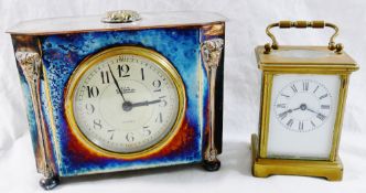 A brass five class carriage clock, the white enamel dial with Roman numerals,