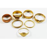 Four 9 carat gold rings and one other gold ring (marks worn), combined weight 11.