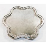 An Austrian silver plated flower head shaped tray, raised on three feet, by Art Krupp of Berndorf,