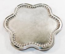 An Austrian silver plated flower head shaped tray, raised on three feet, by Art Krupp of Berndorf,