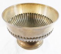 A silver rose bowl with half gadrooned body on circular pedestal, marks rubbed, unengraved,