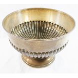 A silver rose bowl with half gadrooned body on circular pedestal, marks rubbed, unengraved,