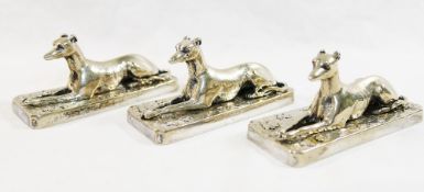 Three Elkington and Co. silver plated recumbent greyhound paperweights, 9.