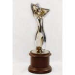 A chrome plated figure of a nude, in a similar pose to Man Ray's 'Herma', unsigned, 20cm high,