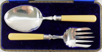 A George V silver and ivorine handled serving spoon and fork, Sheffield 1912,