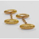 A pair of Edwardian 9 carat gold cuff links, with engraved floral decoration, Birmingham 1907,