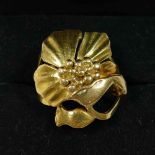 An 18 carat gold dress ring, cast in the form of a naturalistic flower head, London 1972,