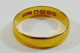 A 22 carat gold wedding band, Birmingham 1921 or 1946, finger size finger size R, 3.