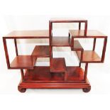 A set of 20th century Chinese table top hardwood shelves, inlaid with wire, 33cm x 15cm x 42.