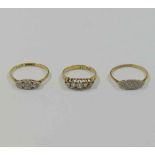 Three early 20th century diamond rings, two stamped '18CT and PLAT',