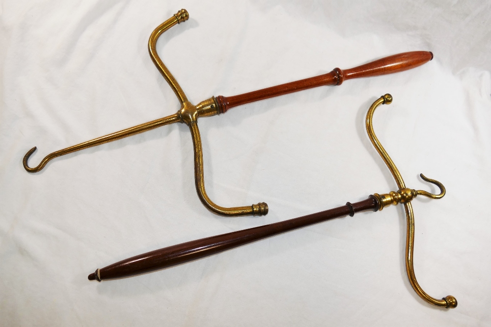 Two barrister's gown/wig hangers with turned handles, one having been reversed, 51cm and 64.