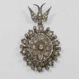 A 19th century oval diamond pendant, with bird surmount, set in white and yellow,