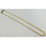 A string of Mikimoto individually knotted cultured pearls, with white metal clasp stamped '10K',