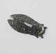 A Kenneth Jay Lane cicada brooch, set with paste and hematite, maker's stamp to underside, 8.