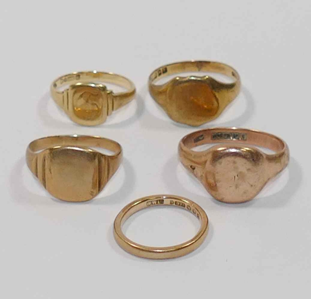 Four 9 carat gold signet rings and a 9 carat gold wedding band, - Image 2 of 2