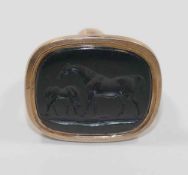 A 19th century gold seal, set with a black onyx panel intaglio carved with a mare and foal,
