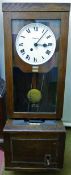 A Simplex oak cased clocking in clock, numbered 75915,