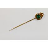 A simulated emerald paste set stick pin with entwined snake terminal, 6.