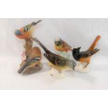 A collection of ceramic bird figures and groups including a Royal Worcester porcelain bird group