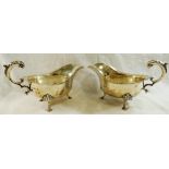 A pair of George V silver gravy boats, Sheffield 1918, with wavy rims and acanthus scroll handles,