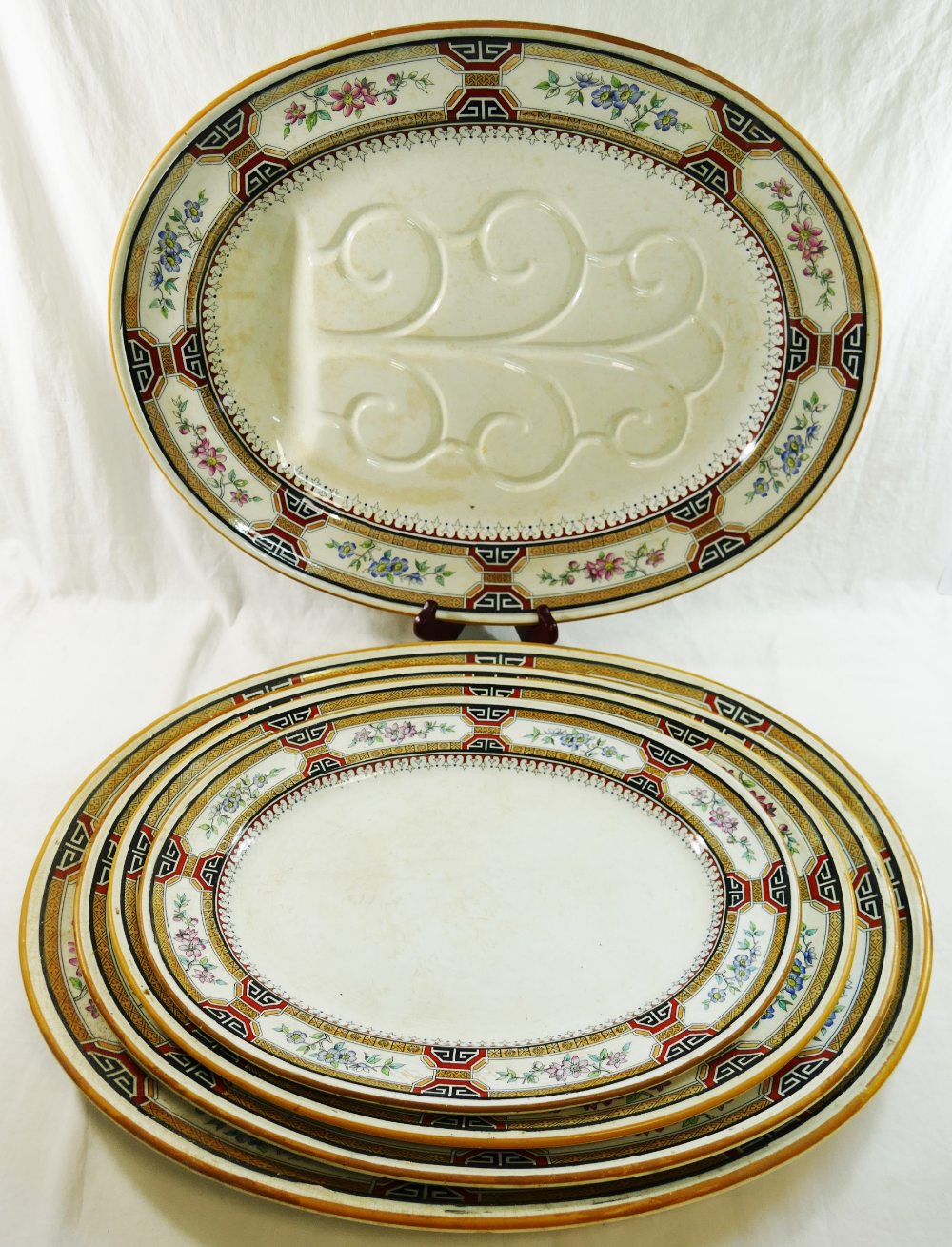 A large quantity of Minton 'Chinese Key' dinnerware comprised of two large oval serving plates,