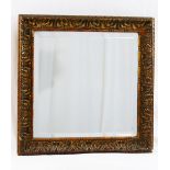 A small square bevelled edge wall mirror housed in an acanthus leaf moulded and frame with beaded