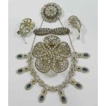 A collection of vintage costume jewellery comprised of a pair of earrings,